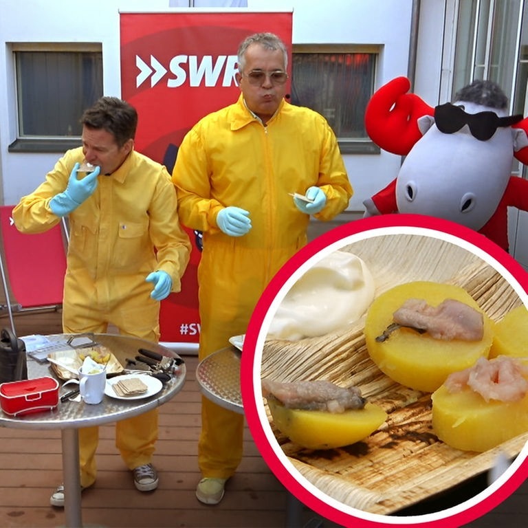 Zwei Moderatoren in gelben Klamotten esse Ekelfisch (Foto: SWR3)