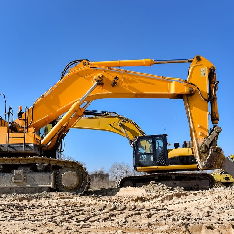 Zwei gelbe Bagger  (Foto: Adobe Stock / Countrypixel)