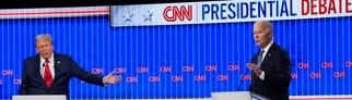US-Präsident Joe Biden (r) und der ehemalige US-Präsident Donald Trump auf der Bühne bei der von CNN veranstalteten Präsidentschaftsdebatte.