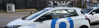 Ein Scan-Auto überprüft, ob für abgestellte Autos die Parkgebühren bezahlt wurden