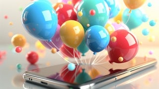Ballons als Geburtstagswünsche auf einem Smartphone. Symbolbild für lustige Whatsapp-Sprüche und Grüße zum Geburtstag.