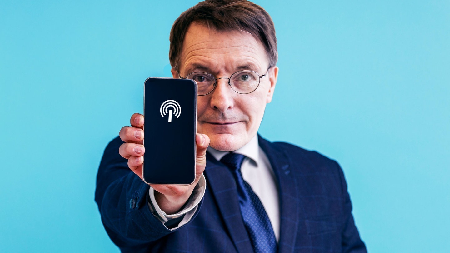 Foto: picture-alliance / Reportdienste, picture-alliance Lauterbach zeigt Handy mit Hotspot (Foto: picture-alliance / Reportdienste, picture-alliance)