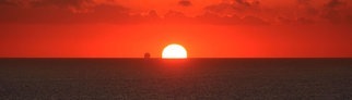 Sonnenuntergang mit Schiff