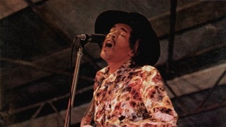Der Gitarrist und Sänger Jimi Hendrix bei einem Auftritt im jahr 1968 im englischen Woburn (Foto: picture-alliance / Reportdienste, Avalon/Retna | Michael Putland) Der Gitarrist und Sänger Jimi Hendrix bei einem Auftritt im jahr 1968 im englischen Woburn