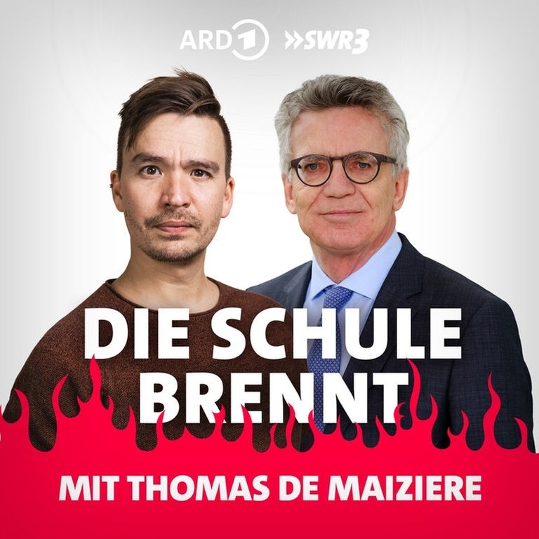 Thomas de Maizière und Bob Blume vor Flammen (Foto: SWR3)